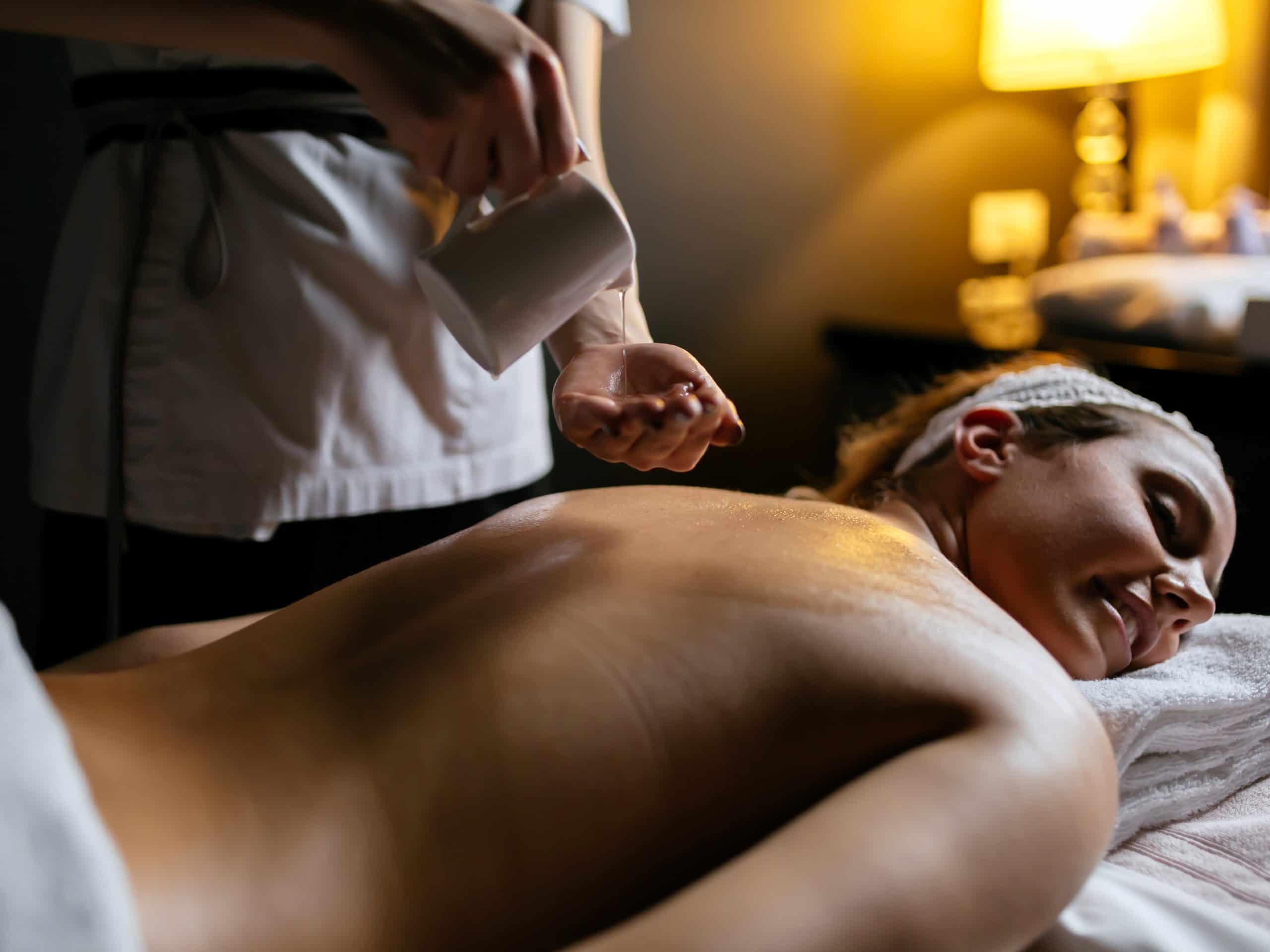 Oil massage treatment for a beautiful brunette